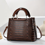 Chic crocodile pattern women’s shoulder bag with adjustable strap and zipper closure. Stylish crossbody purse perfect for casual or formal occasions.